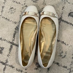 Coach flats. Cream colored leather. Gold buckle